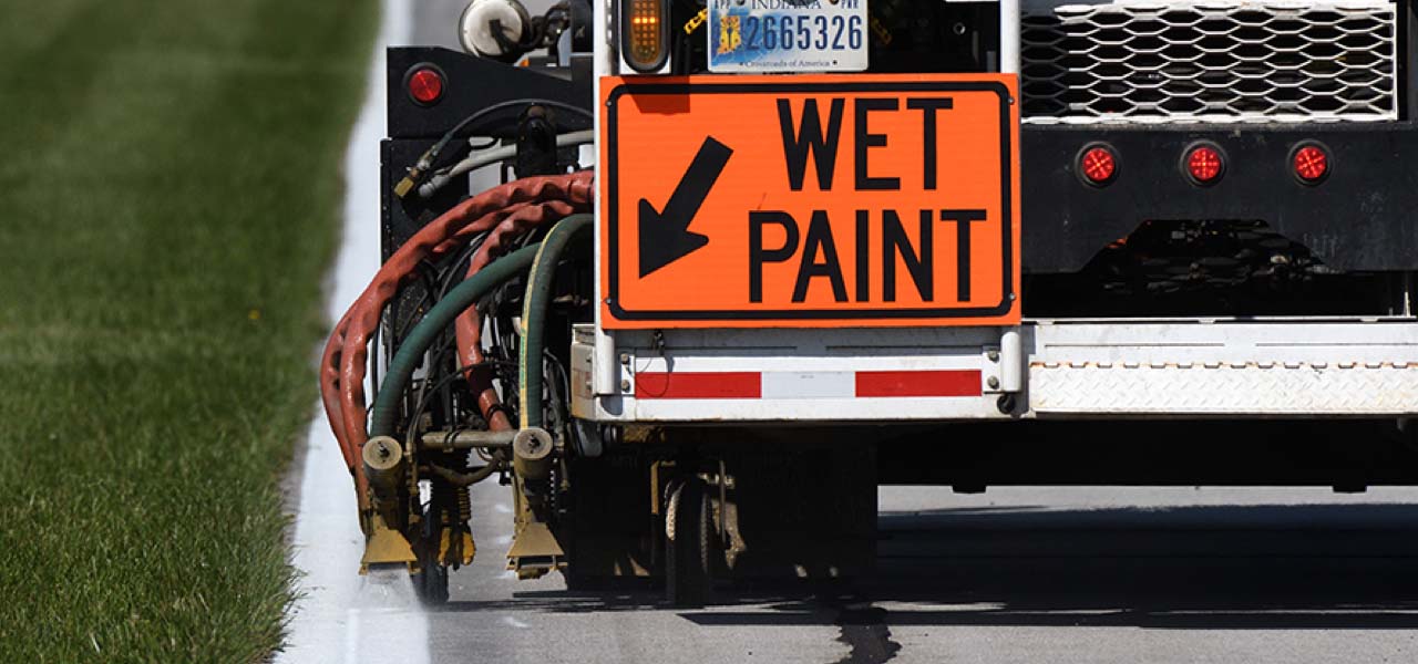 A road paint striping truck. A road paint striping truck.